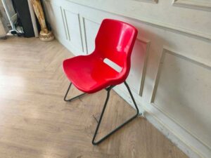 Plastic chair with metal legs, IKEA brand, SNILLE model.