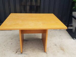 4-seat conference table with wooden legs, brown.