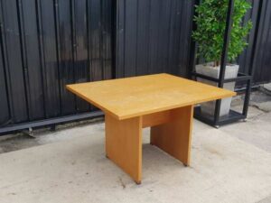 4-seat conference table with wooden legs, brown.