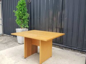 4-seat conference table with wooden legs, brown.