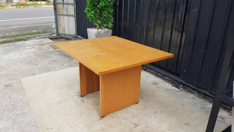 4-seat conference table with wooden legs, brown.