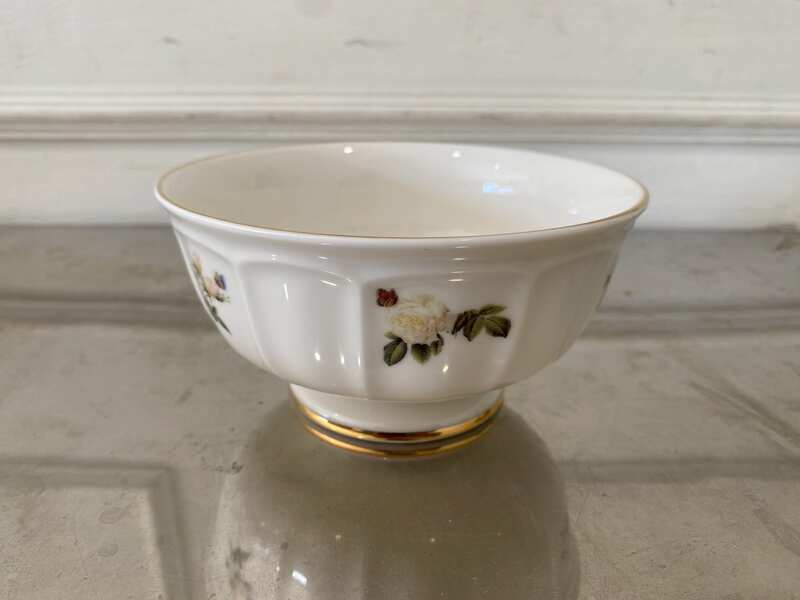 Ceramic cup with white rose pattern and gold rim, Quality Ceramic brand.