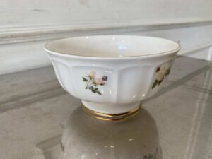 Ceramic cup with white rose pattern and gold rim, Quality Ceramic brand.