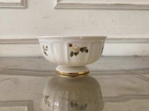 Ceramic cup with white rose pattern and gold rim, Quality Ceramic brand.