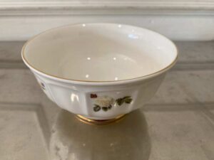 Ceramic cup with white rose pattern and gold rim, Quality Ceramic brand.