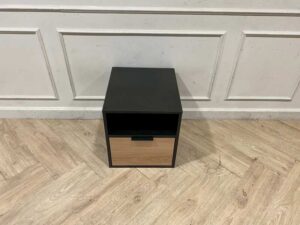 Black wooden cabinet with 1 drawer and 1 storage compartment.
