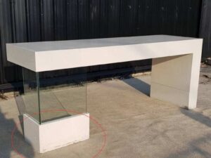 Multipurpose wooden table, white with clear glass top legs.