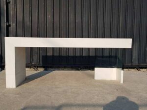 Multipurpose wooden table, white with clear glass top legs.