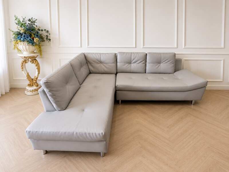 4-seater L-shaped sofa, grey leather upholstery, steel legs, Index brand, Ovira model.