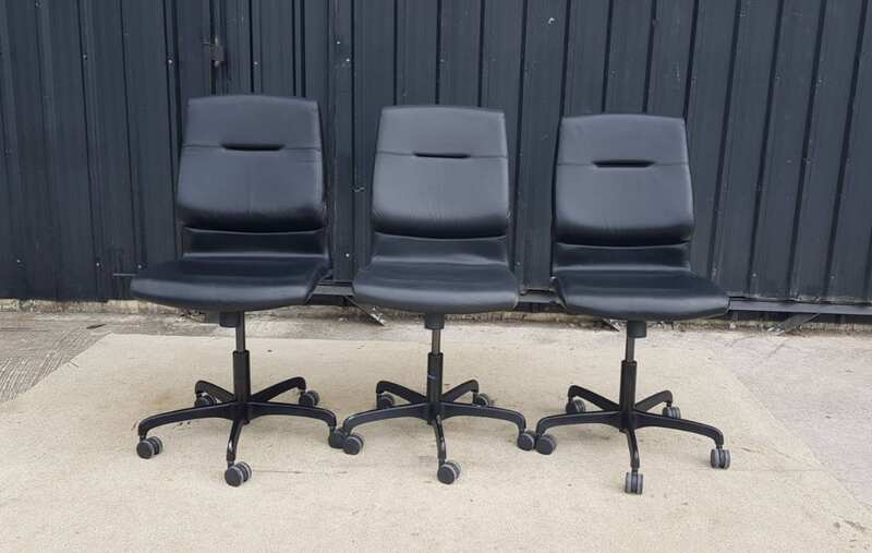 Modernform brand office chair with leather seat, backrest, and steel legs.
