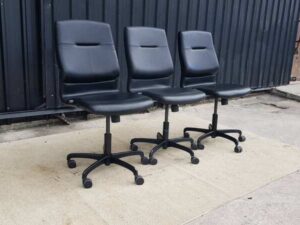 Modernform brand office chair with leather seat, backrest, and steel legs.