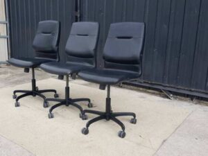 Modernform brand office chair with leather seat, backrest, and steel legs.