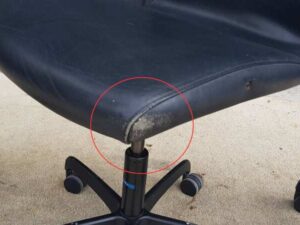 Modernform brand office chair with leather seat, backrest, and steel legs.