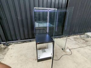 Tall black glass jewelry display cabinet with LED lighting