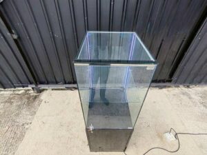 Tall black glass jewelry display cabinet with LED lighting