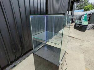 Tall black glass jewelry display cabinet with LED lighting