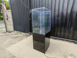 Tall black glass jewelry display cabinet with LED lighting