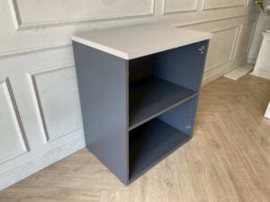Two-tiered wooden filing cabinet with cable management compartment, gray color.