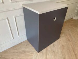 Two-tiered wooden filing cabinet with cable management compartment, gray color.