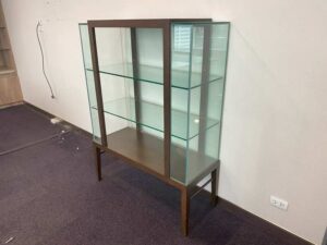 Three-tiered glass display case with wooden frame