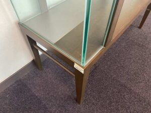 Three-tiered glass display case with wooden frame
