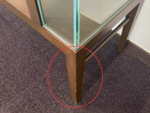 Three-tiered glass display case with wooden frame