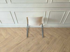Plastic chair with metal legs, IKEA brand, SNILLE model.