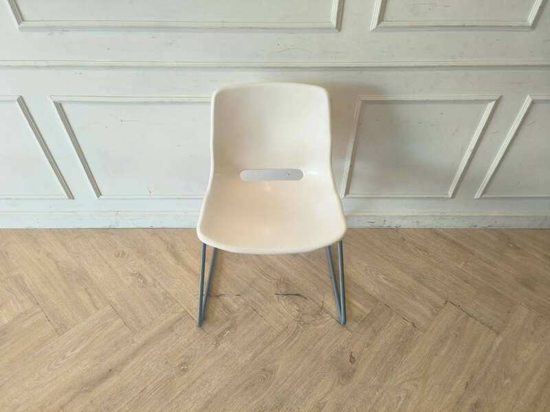 Plastic chair with metal legs, IKEA brand, SNILLE model.
