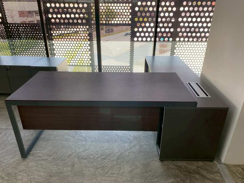 Executive L-shaped corner desk with 3 drawers, 2 shelves, and power strip. PROFLEX brand.