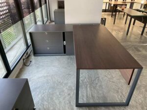 Executive L-shaped corner desk with 3 drawers, 2 shelves, and power strip. PROFLEX brand.