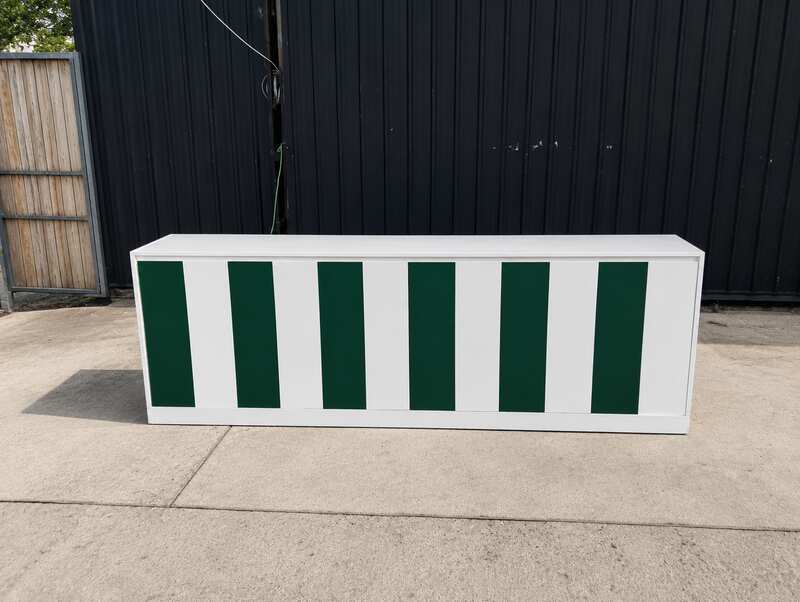 Multipurpose wooden storage cabinet with 6 compartments, white with green stripes.
