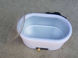 Electric paraffin wax heater with adjustable temperature, white color.