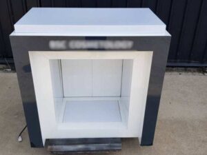Two-door wooden display cabinet, white and black.