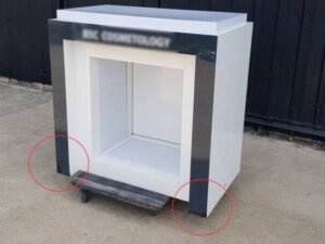 Two-door wooden display cabinet, white and black.