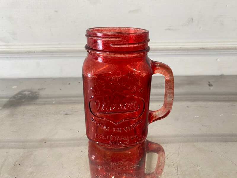 Red Mason Jar-shaped mug with handle and embossed lettering.