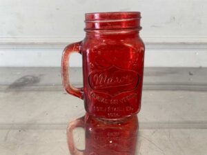 Red Mason Jar-shaped mug with handle and embossed lettering.