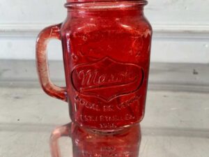 Red Mason Jar-shaped mug with handle and embossed lettering.
