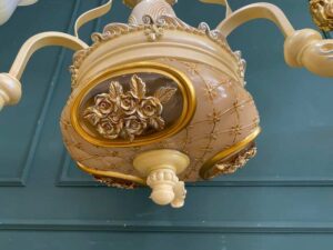 Glass chandelier with floral crown design