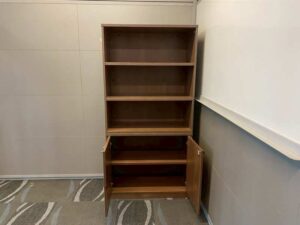 Tall filing cabinet with 2 doors and 3 shelves, brown wooden frame