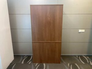 Tall filing cabinet with 2 doors and 3 shelves, brown wooden frame