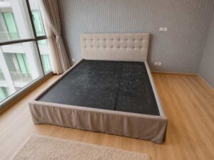 6-foot bed with button tufting, grey fabric mattress, and a 6-foot white topper.