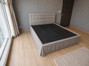 6-foot bed with button tufting, grey fabric mattress, and a 6-foot white topper.