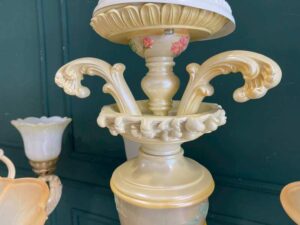 Glass chandelier with fish pattern, cream color.