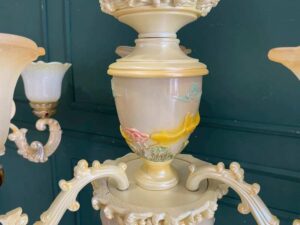 Glass chandelier with fish pattern, cream color.