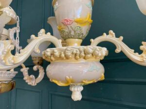 Glass chandelier with fish pattern, cream color.