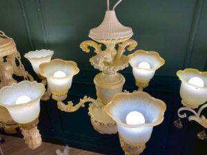 Glass chandelier with fish pattern, cream color.