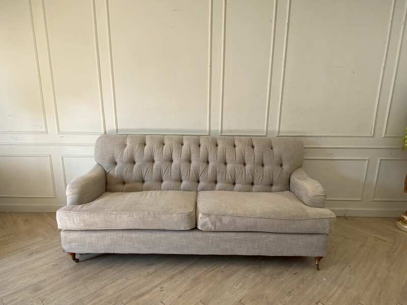 Two-seater sofa, button-tufted fabric upholstery, grey.