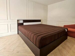 Asian-Bed brand pocket spring mattress with soft, feather-like fabric cover, dark brown color.