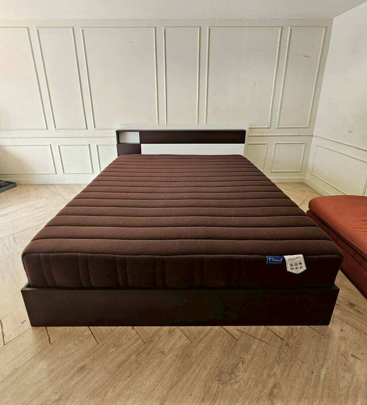 Asian-Bed brand pocket spring mattress with soft, feather-like fabric cover, dark brown color.