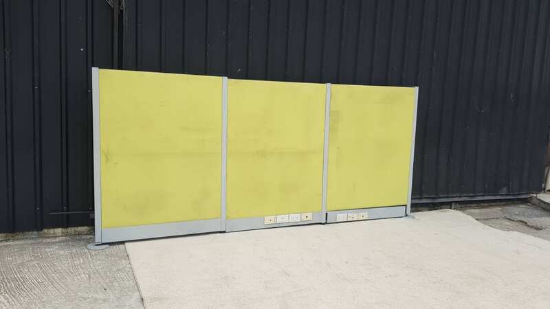 Office partition with power outlet, light green.